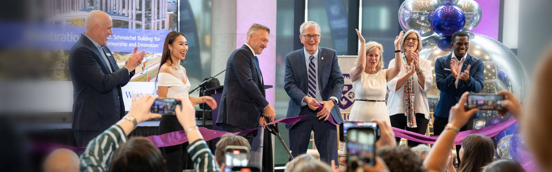 A ribbon cutting at the opening of the Ronald D. Schmeichel Building for Entrepreneurship and Innovation